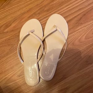 Nude flip flops and they do run small